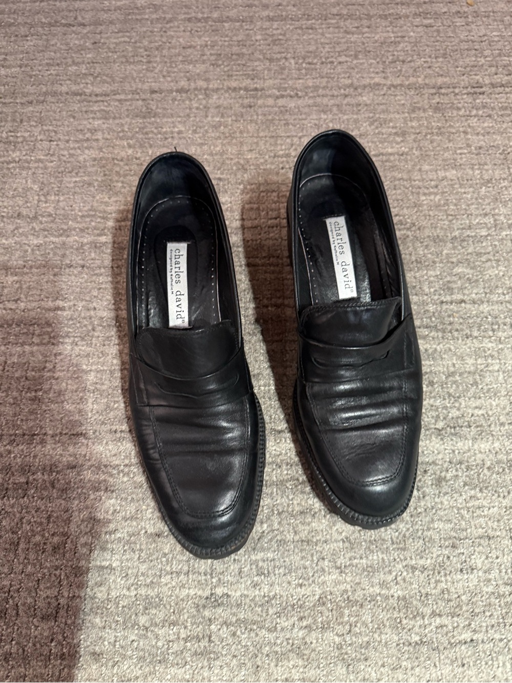 Charles David Black Leather Women's Loafers with lug sole and heel.